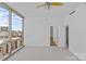Well lit bedroom featuring a neutral carpet, city views from the windows, and nearby closet access at 315 Arlington Ave # 1206, Charlotte, NC 28203