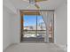Sun-filled bedroom boasts a large window with city views and neutral decor at 315 Arlington Ave # 1206, Charlotte, NC 28203