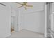 Bright bedroom with a ceiling fan, neutral colors, and ample closet space at 315 Arlington Ave # 1206, Charlotte, NC 28203