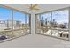 Sun-filled bedroom features large windows showcasing an expansive city view and a stylish ceiling fan at 315 Arlington Ave # 1206, Charlotte, NC 28203