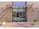 Building entrance featuring glass doors, modern awning, and brick facade in an inviting urban setting at 315 Arlington Ave # 1206, Charlotte, NC 28203