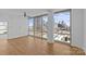 Bright living room features hardwood floors and expansive city views through large windows at 315 Arlington Ave # 1206, Charlotte, NC 28203
