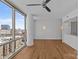 Open-concept living room features modern flooring, large windows with city views, and contemporary lighting at 315 Arlington Ave # 1206, Charlotte, NC 28203
