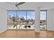 Stunning city views framed by floor-to-ceiling windows in a bright living area with modern hardwood floors at 315 Arlington Ave # 1206, Charlotte, NC 28203