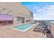 Inviting rooftop pool with lounge area and stunning skyline backdrop at 315 Arlington Ave # 1206, Charlotte, NC 28203