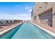 Rooftop pool featuring clear blue water and city views beyond the lounge area at 315 Arlington Ave # 1206, Charlotte, NC 28203