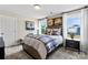 Comfortable bedroom with a cozy bed, two windows, and stylish decor at 318 Balboa St, Matthews, NC 28104