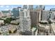 Exterior aerial view of modern high-rise building, with rooftop pool, green space, and downtown views at 333 W Trade St # 2503, Charlotte, NC 28202