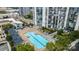 Exterior view of a large rectangle pool with sundeck surrounded by lush landscaping at 333 W Trade St # 2503, Charlotte, NC 28202