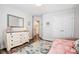 Bedroom view showcasing a white dresser and a doorway leading to another room at 3925 Rothwood Ln, Harrisburg, NC 28075