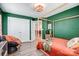 Spacious bedroom featuring wood floors, closet, and stylish green walls at 3925 Rothwood Ln, Harrisburg, NC 28075