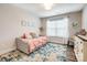 Cozy bedroom featuring daybed with pink bedding and a large blue floral area rug at 3925 Rothwood Ln, Harrisburg, NC 28075