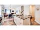 Open-concept kitchen featuring granite counters, stainless steel appliances, and seamless connection to the living space at 3925 Rothwood Ln, Harrisburg, NC 28075