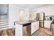 Bright kitchen with granite countertops, stainless steel appliances, and an island with a dishwasher at 3925 Rothwood Ln, Harrisburg, NC 28075