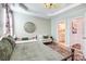 Comfortable main bedroom with decorative mirror, natural light, and an en-suite bathroom at 3925 Rothwood Ln, Harrisburg, NC 28075