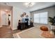 Office featuring a large desk, monitor, rug, and natural light at 3925 Rothwood Ln, Harrisburg, NC 28075