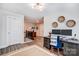 Upstairs office with a large desk, monitors, and decor at 3925 Rothwood Ln, Harrisburg, NC 28075