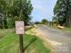 Harrisburg Village private walking trail entrance near beautifully landscaped homes at 3925 Rothwood Ln, Harrisburg, NC 28075
