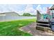 Green backyard with a white fence, patio steps and outdoor seating area perfect for relaxation at 4009 Polkville Rd, Shelby, NC 28150