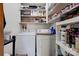 Functional laundry room with washer, dryer, and shelving for storage at 4009 Polkville Rd, Shelby, NC 28150