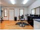 Bright salon space featuring styling chair, mirror and wood floors at 4009 Polkville Rd, Shelby, NC 28150