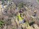 High angle view showing the house nestled among lush trees and foliage at 534 Kirby Ln, Matthews, NC 28104