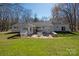Backyard features a patio with a fire pit and outdoor kitchen area, great for entertaining and outdoor enjoyment at 534 Kirby Ln, Matthews, NC 28104