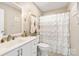 Bathroom featuring a vanity, toilet, and bathtub with shower and ruffled curtain at 534 Kirby Ln, Matthews, NC 28104