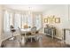 Charming breakfast nook with a chandelier, large windows, and views of the yard at 534 Kirby Ln, Matthews, NC 28104