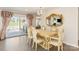 Elegant dining room with French doors, beautiful chandelier, and hardwood flooring at 534 Kirby Ln, Matthews, NC 28104