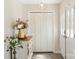 Bright entryway featuring a decorative light fixture, hardwood floors, and front door at 534 Kirby Ln, Matthews, NC 28104