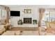 Cozy living room showcasing a brick fireplace, hardwood floors, and stylish decor at 534 Kirby Ln, Matthews, NC 28104