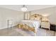 Bright main bedroom features hardwood floors, closet, and ornate bed frame at 534 Kirby Ln, Matthews, NC 28104