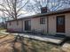 View of the back of the house featuring a patio with chairs and door entrance at 5534 Little Mountain Rd, Catawba, NC 28609