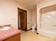 Well-lit bathroom featuring a combined tub and shower unit and a toilet at 5534 Little Mountain Rd, Catawba, NC 28609