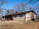 Exterior shot showing neutral horizontal siding, screened in porch, and roof at 5534 Little Mountain Rd, Catawba, NC 28609