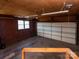 Spacious garage featuring a large door, window, and concrete flooring at 5534 Little Mountain Rd, Catawba, NC 28609