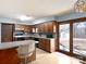 Functional kitchen with wooden cabinetry, vintage-style island, and access to the backyard at 5534 Little Mountain Rd, Catawba, NC 28609