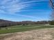 A view of the countryside property, with a long driveway and expansive green space at 5534 Little Mountain Rd, Catawba, NC 28609