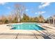 Beautiful community pool with surrounding lounge area and nearby clubhouse at 571 Rough Hewn Ln, Rock Hill, SC 29730