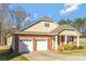 Charming two-story home featuring a two-car garage and well-maintained landscaping at 571 Rough Hewn Ln, Rock Hill, SC 29730