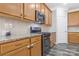 Modern kitchen with stainless steel gas range, microwave, and granite counters at 571 Rough Hewn Ln, Rock Hill, SC 29730