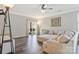 Spacious living room with hardwood floors, recessed lighting, and sliding glass door to backyard at 571 Rough Hewn Ln, Rock Hill, SC 29730