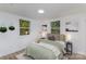 Bright bedroom with two windows, comfortable bedding, and stylish bedside tables at 5825 Greene St, Charlotte, NC 28269