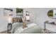 Relaxing bedroom with plush bedding, neutral tones, and minimalist decor at 5825 Greene St, Charlotte, NC 28269