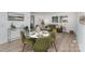 Open-concept dining area features modern table and chairs with bright, natural light at 5825 Greene St, Charlotte, NC 28269
