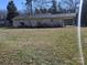 Back exterior of home showing an expansive lawn at 5924 Freedom Dr, Charlotte, NC 28214