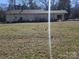 View of the home's rear exterior, displaying the generous backyard at 5924 Freedom Dr, Charlotte, NC 28214
