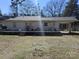 Backyard with expansive deck, carport, and ample space for outdoor activities at 5924 Freedom Dr, Charlotte, NC 28214
