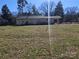 Back exterior view of the house with a spacious backyard at 5924 Freedom Dr, Charlotte, NC 28214